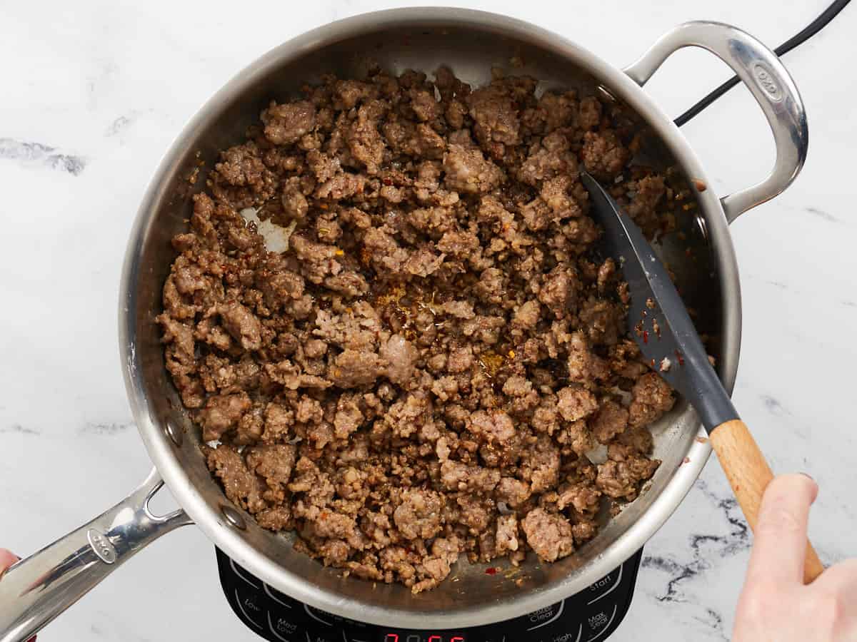 Browned sausage in a skillet.