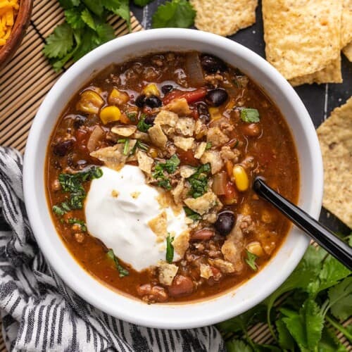 One bowl of taco soup with toppings.