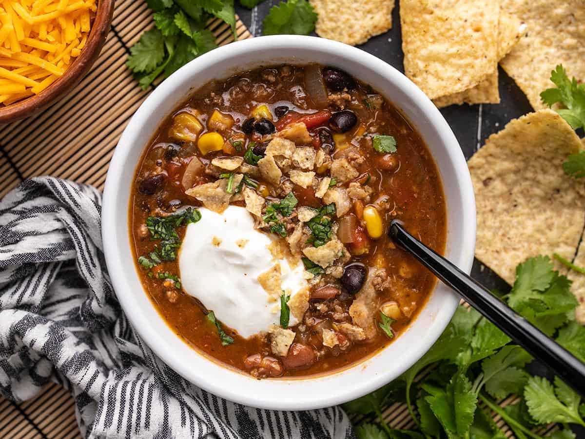 One bowl of taco soup with toppings.