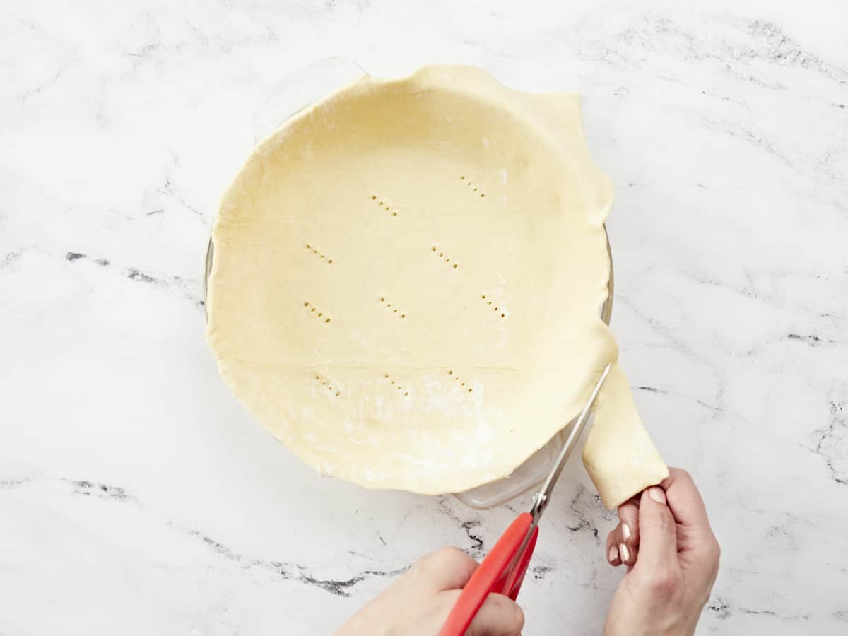 Overhead shot of puff pastry being trimmed.