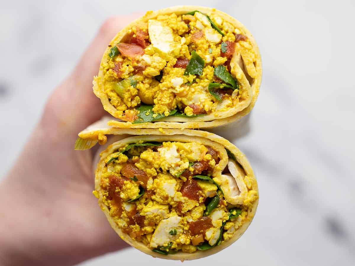 Cross section of a burrito made with tofu scramble.