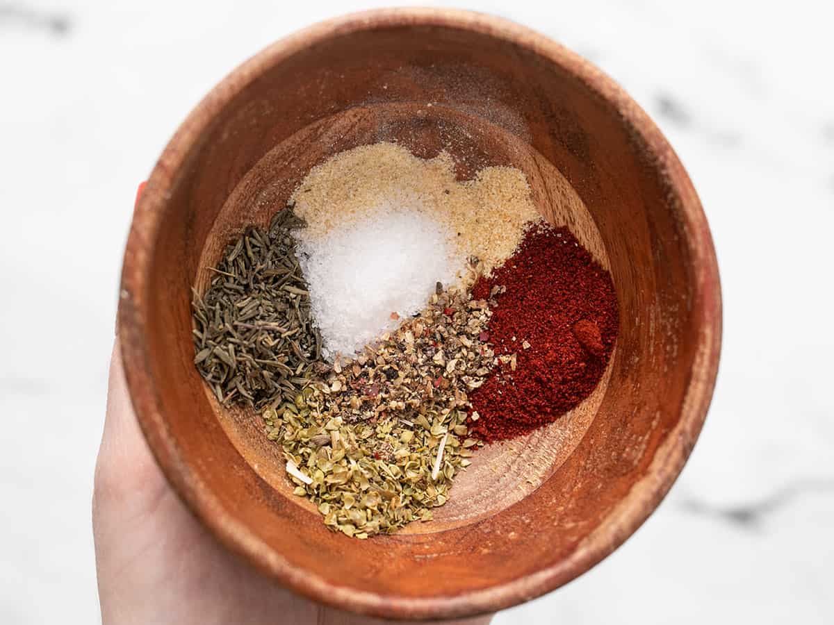 Cajun seasoning herbs and spices in a bowl not mixed.