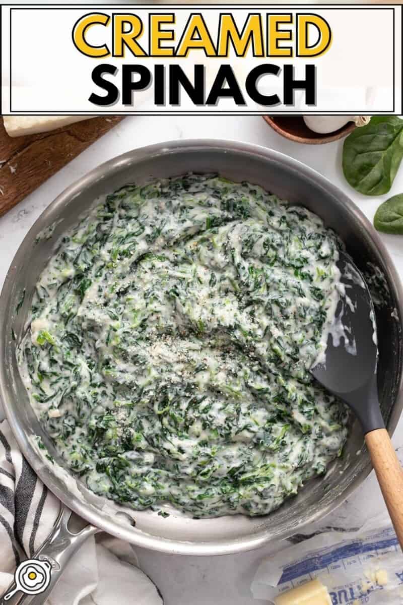 Overhead view of creamed spinach in a skillet.