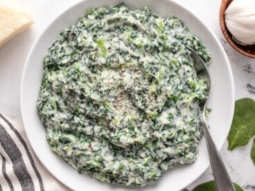 Overhead view of creamed spinach in a bowl.