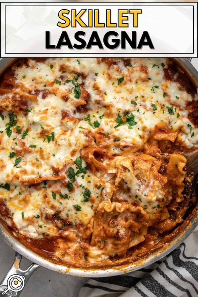 Overhead view of a skillet lasagna with the side scooped out.