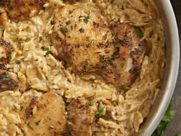Overhead shot of Creamy Chicken and Orzo in a silver skillet.