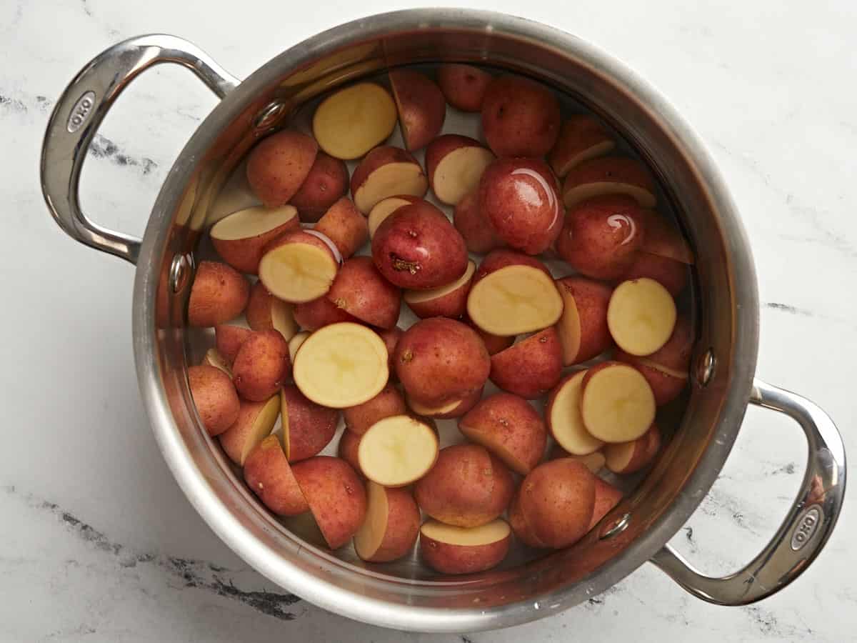 Potatoes in a pot of water.