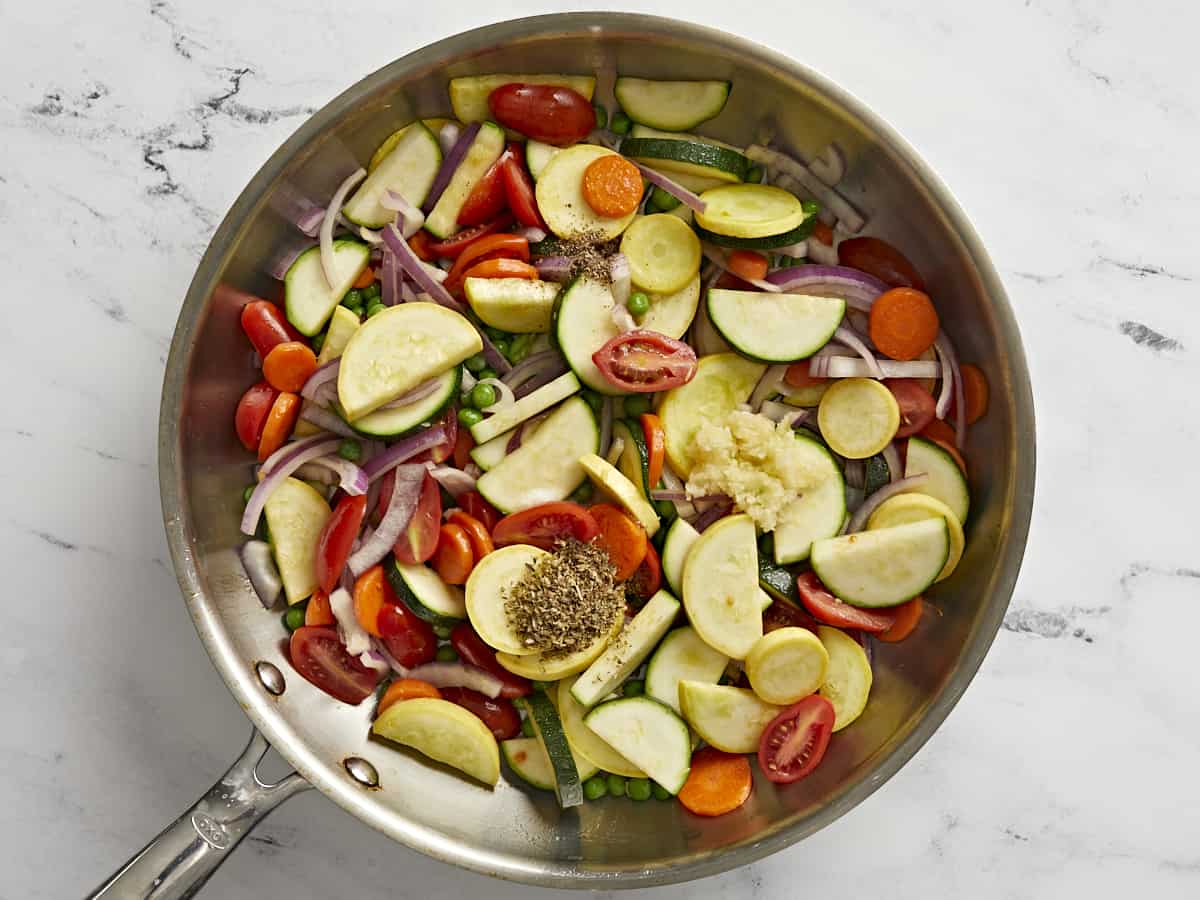 Sautéed vegetables in a skillet.