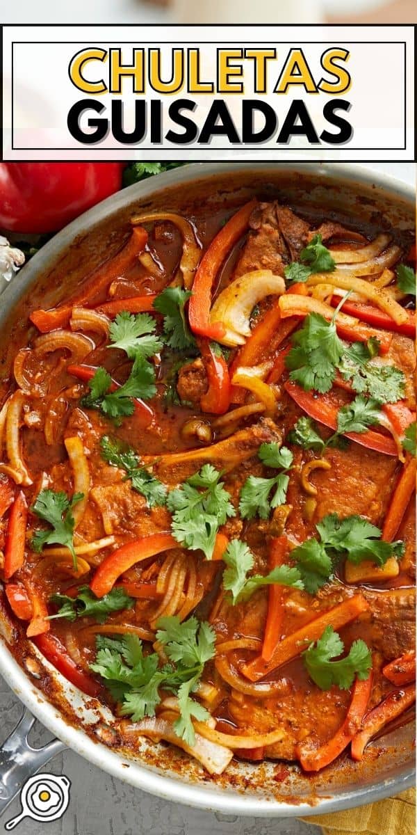 Overhead shot of Chuletas Guisadas in a silver saucepan.