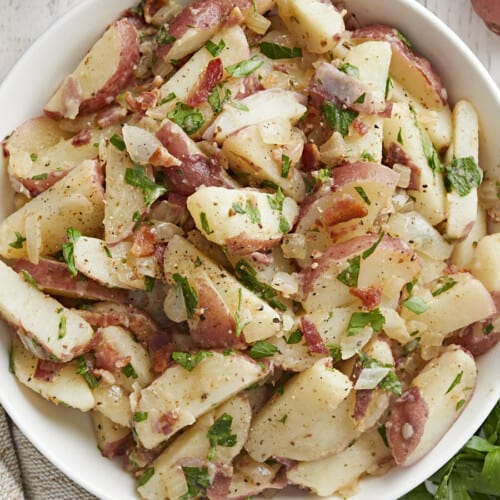 Close up overhead view of a bowl of German Potato Salad in a bowl.