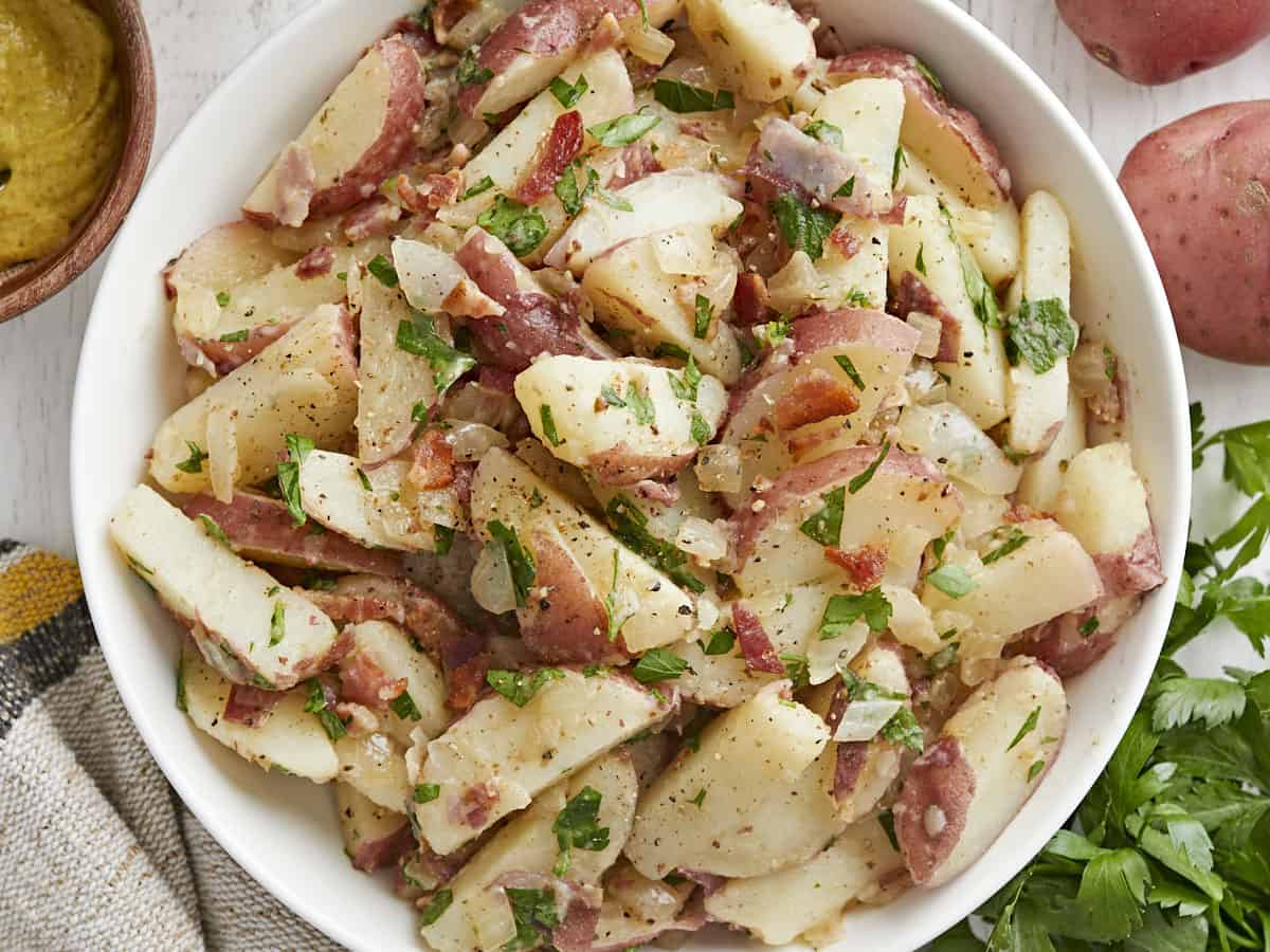 Close up overhead view of a bowl of German Potato Salad in a bowl.