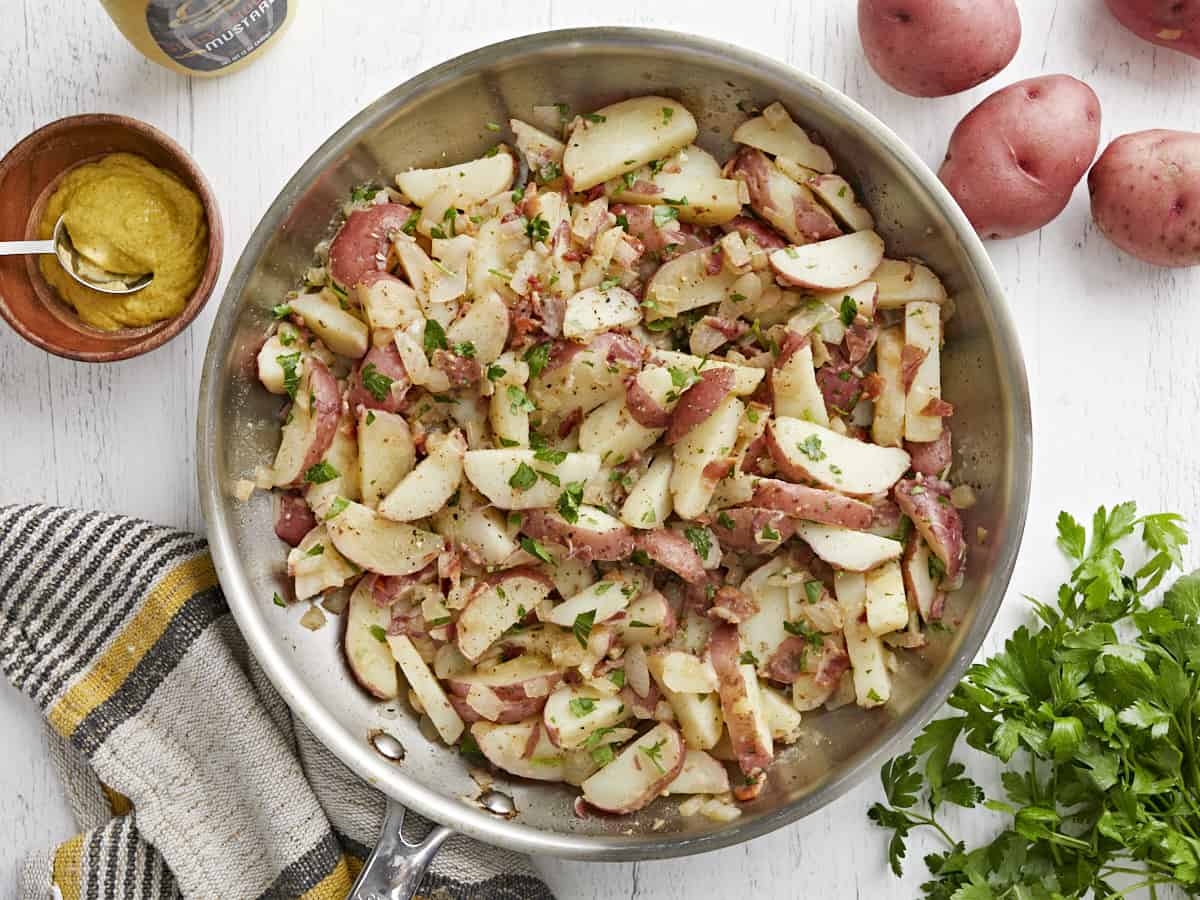 Overhead view of German potato salad in the skillet.
