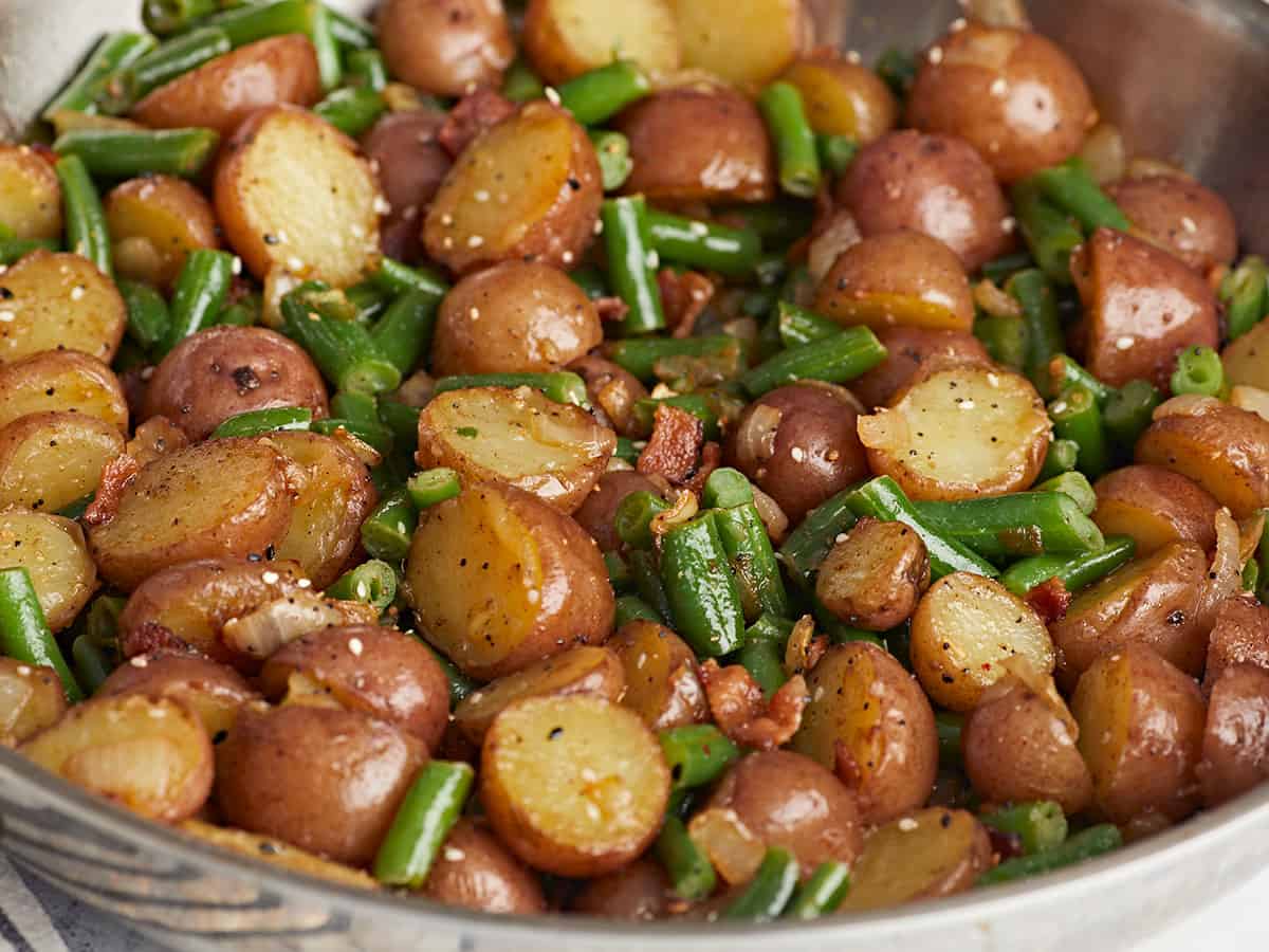 Close up side view of green bean and potato skillet. 