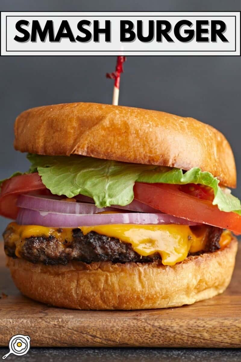 Side shot of a Smash Burger with a toothpick in the bun.