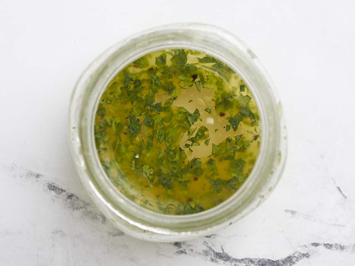 Overhead shot of dressing in a small mason jar.