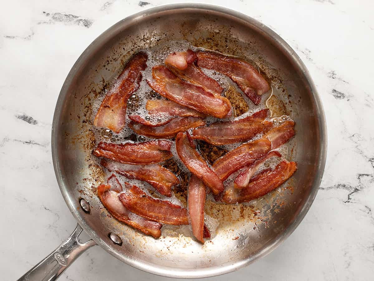 Cooked bacon in a skillet.