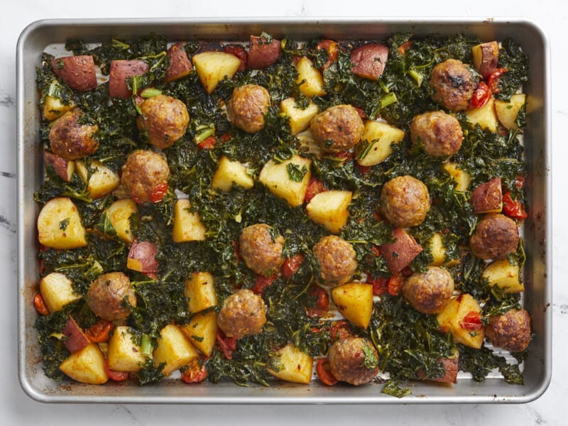 Overhead shot of finished Sausage Meatball and Kale Sheet Pan Meal.