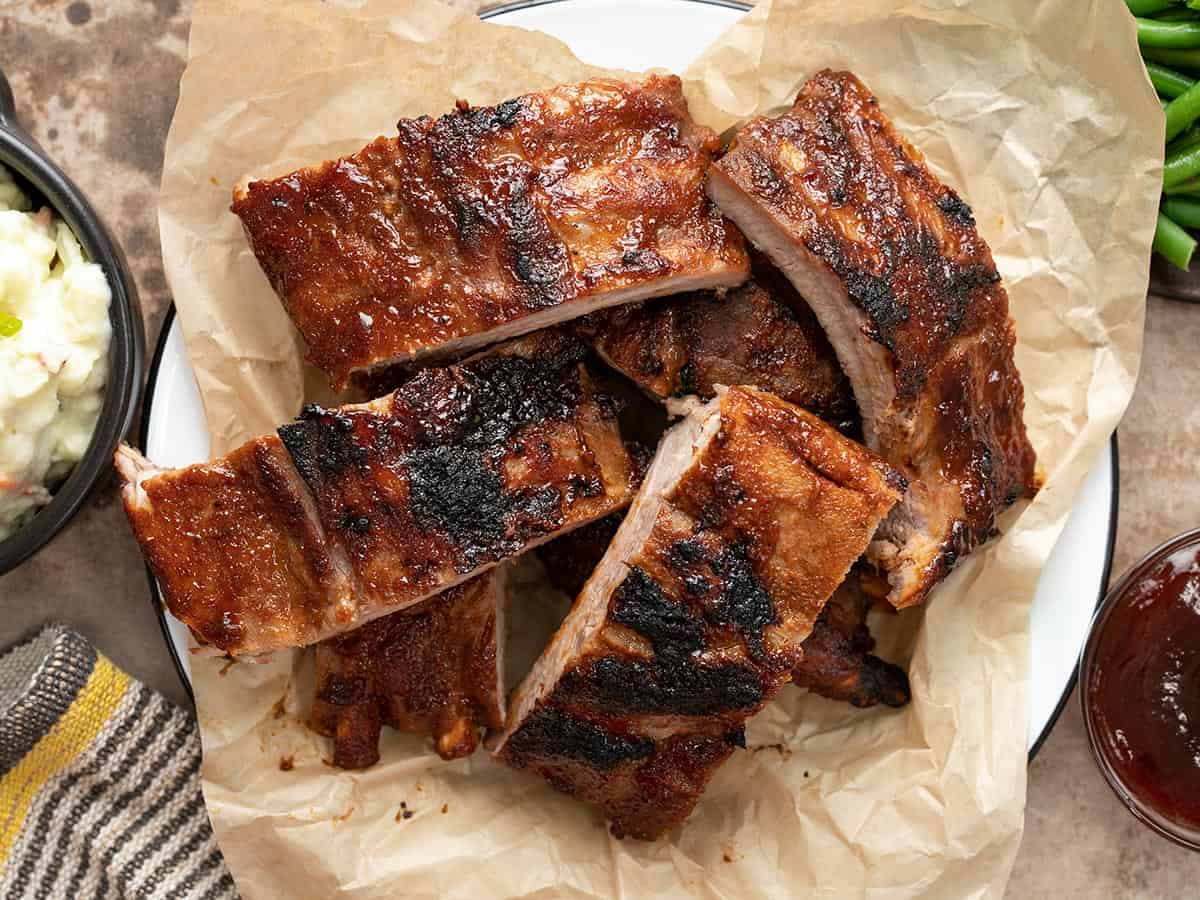Cut ribs on a plate lines with parchment paper.