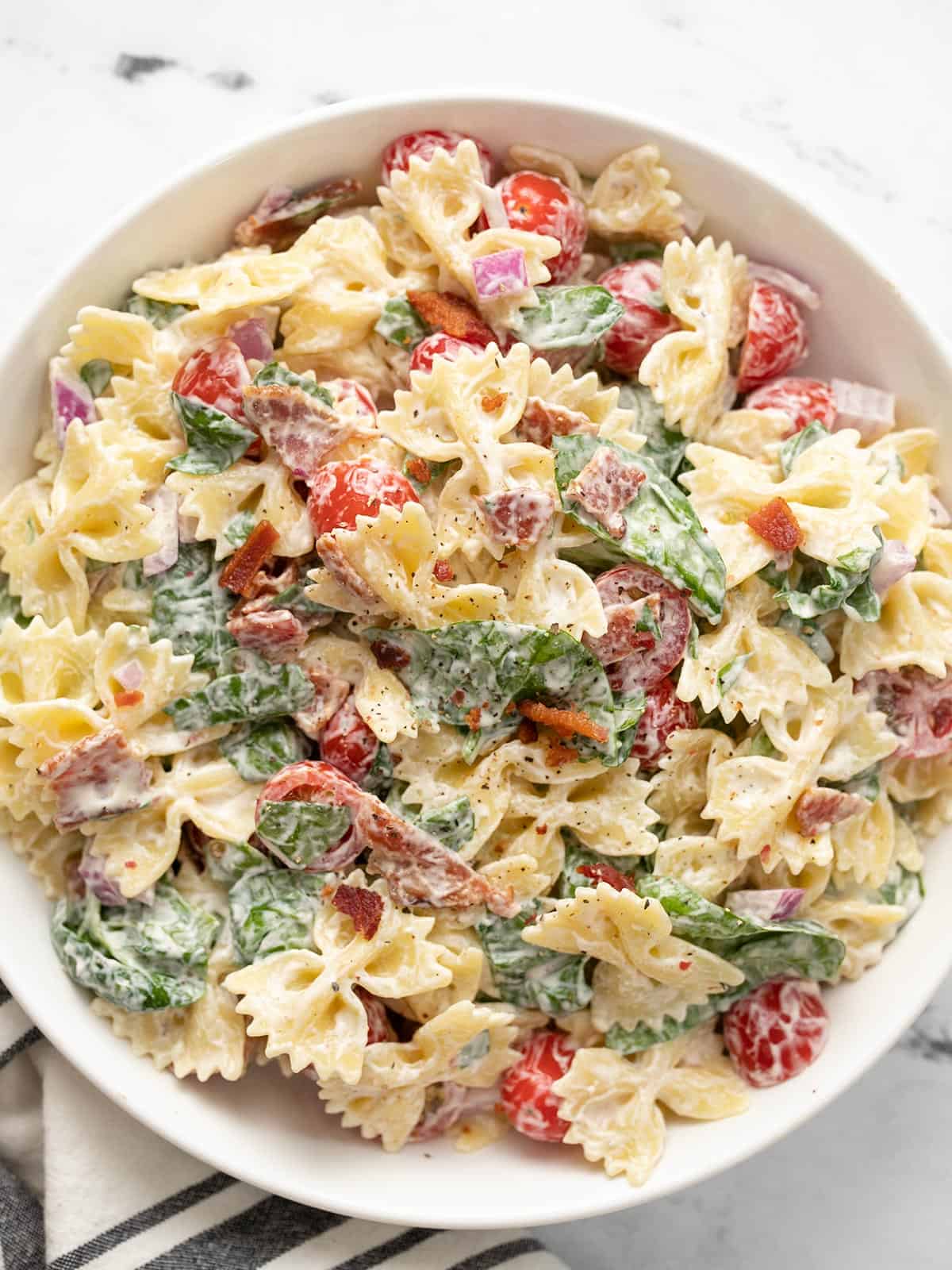 Overhead view of a bowl full of BLT pasta salad.