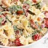Close up side view of a bowl of BLT pasta.