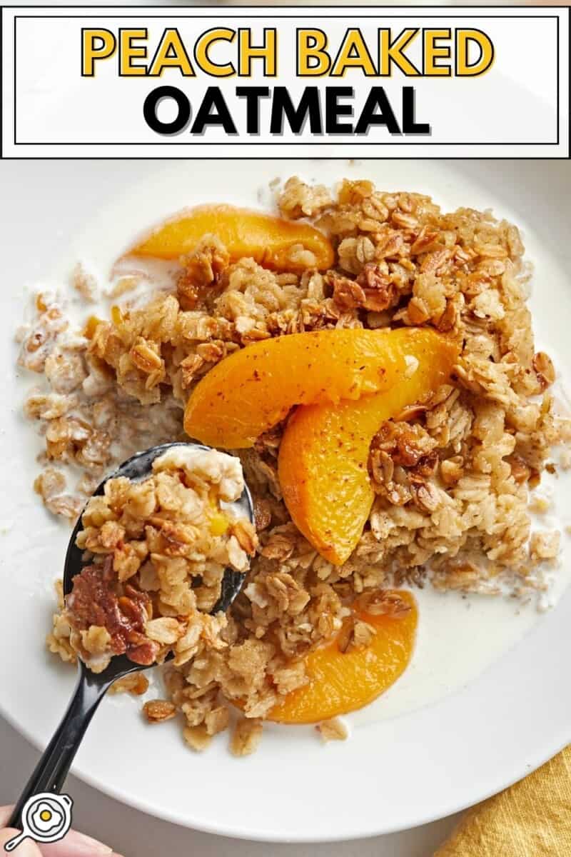 Overhead shot of Peach Baked Oatmeal in a white bowl with cream in it with a spoon lifting a portion out of it.
