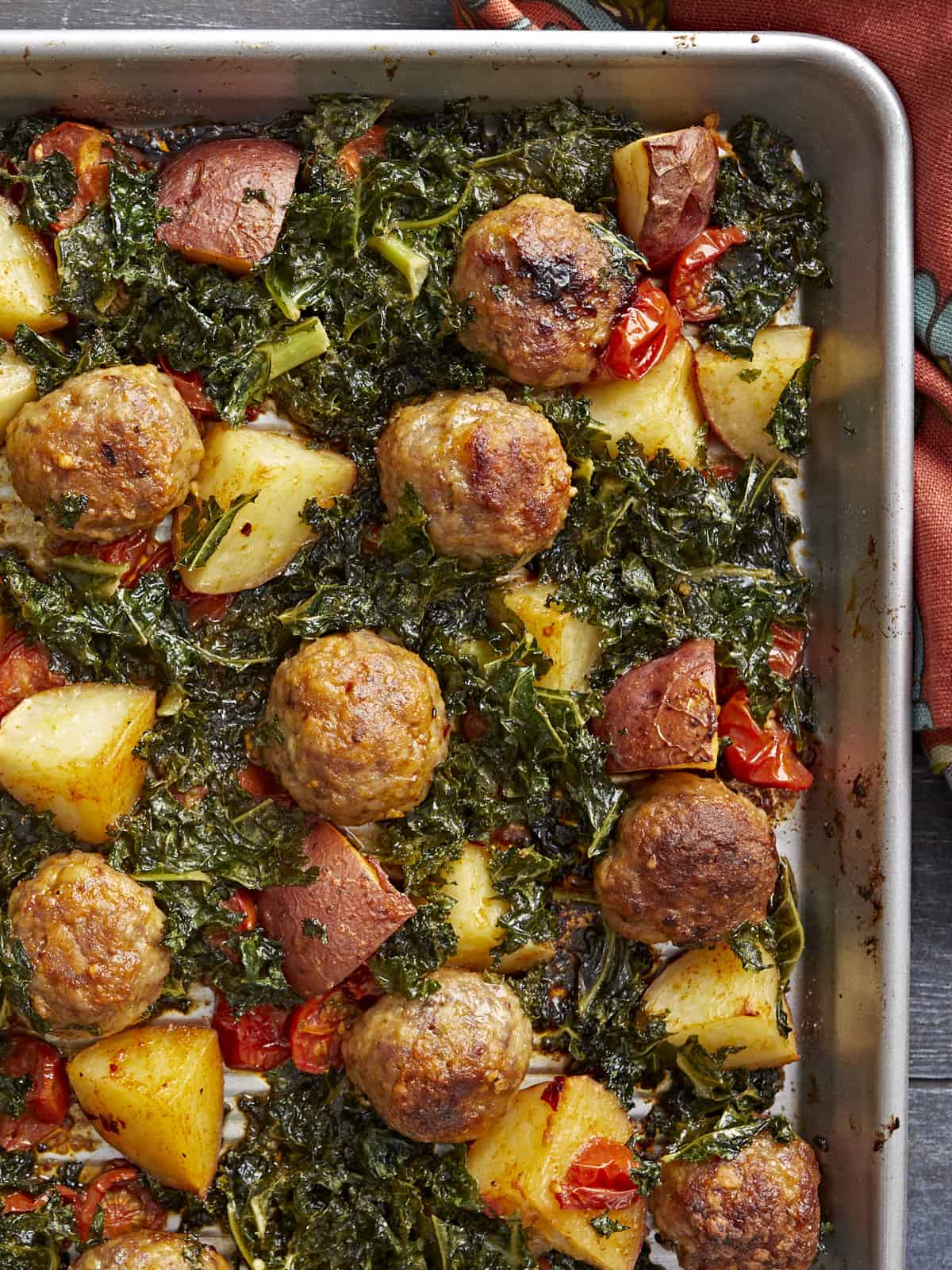 Overhead shot of Sausage Meatball and Kale Sheet Pan Meal.