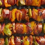 Close up overhead view of BBQ sausage kebabs.