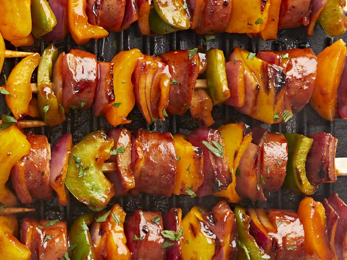 Close up overhead view of BBQ sausage kebabs.