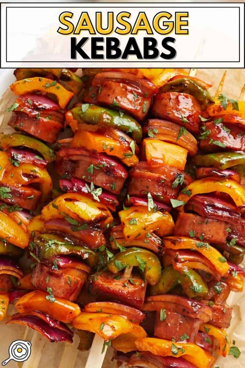 Sausage Kebabs on a serving platter with parchment paper.