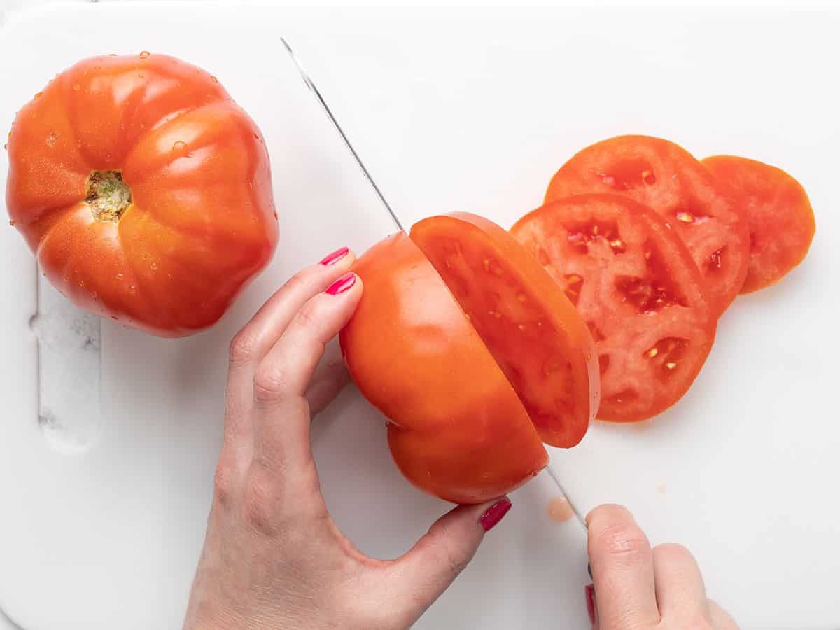 Tomatoes being sliced.