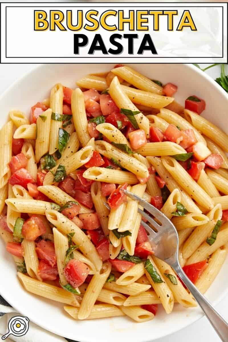 Close up overhead view of a bowl full of Bruschetta Pasta with title text at the top.