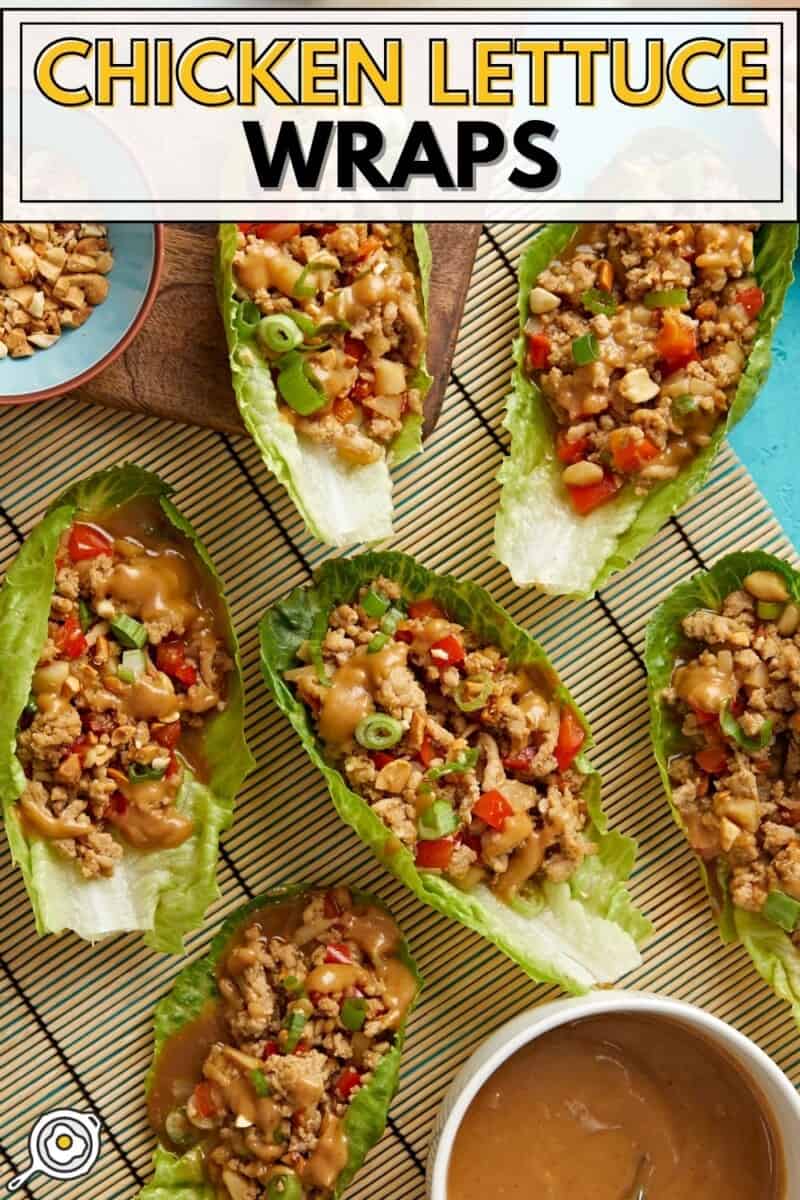 Overhead shot of chicken lettuce wraps with chopped peanuts and peanut lime dressing served on the side and title text at the top.