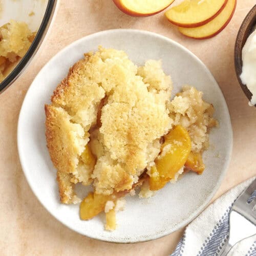 Overhead view of a plate of peach cobbler.