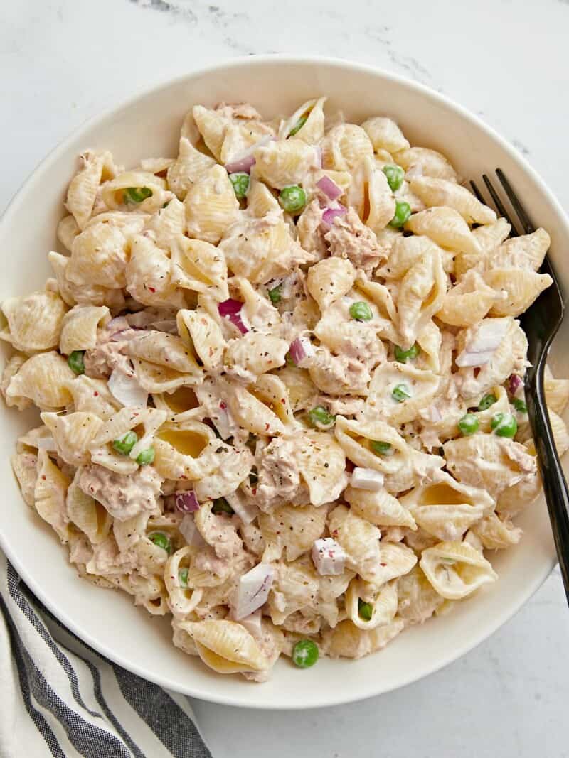 Close up overhead view of a bowl full of tuna pasta salad.