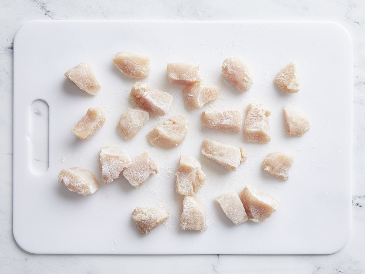 Chicken breast nuggets seasoned with salt and dusted with flour.