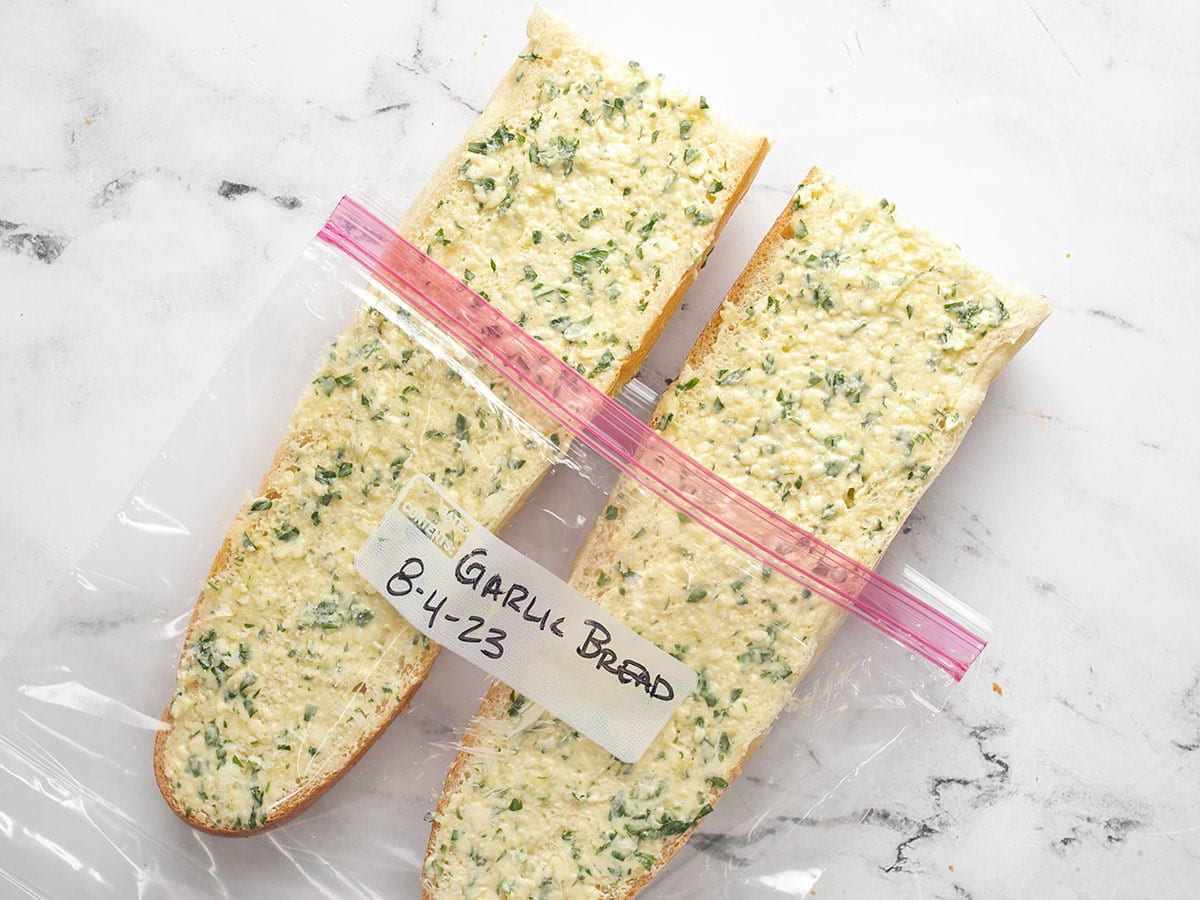 Unbaked garlic bread in a freezer bag.