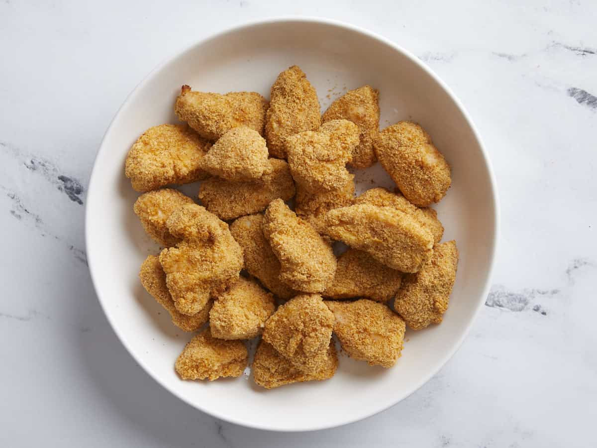 Cooked Air Fryer Chicken Nuggets plated in a serving dish.