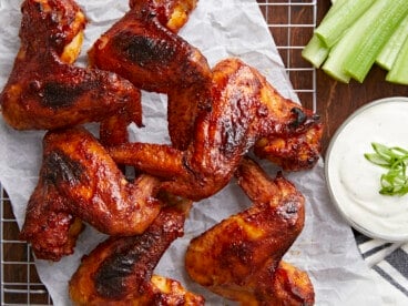 Overhead shot of finished BBQ Wings on a rack set over a sheet pan.