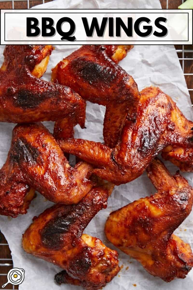 Overhead shot of finished BBQ Wings on a rack set over a sheet pan.