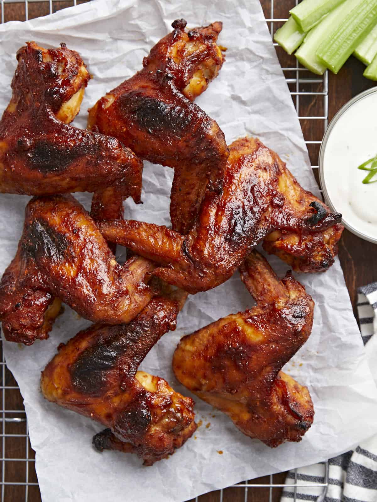 Overhead shot of finished BBQ Wings on a rack set over a sheet pan.