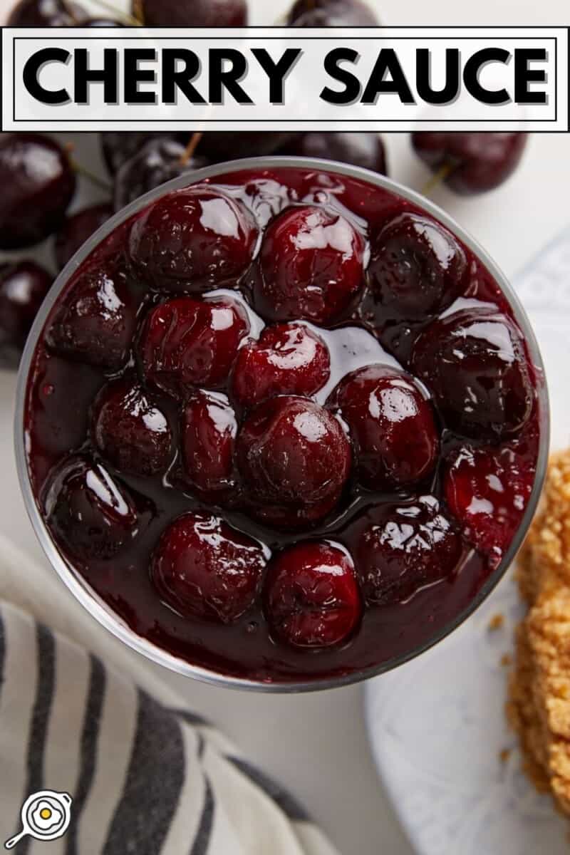 Overhead view of a glass dish full of cherry sauce.