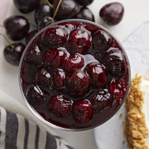 Overhead view of cherry sauce in a glass dish.