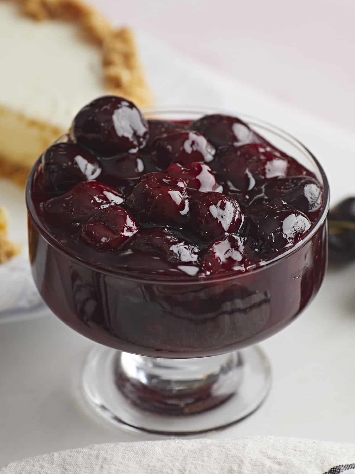 Finished cherry sauce in a glass dish, viewed from the side.