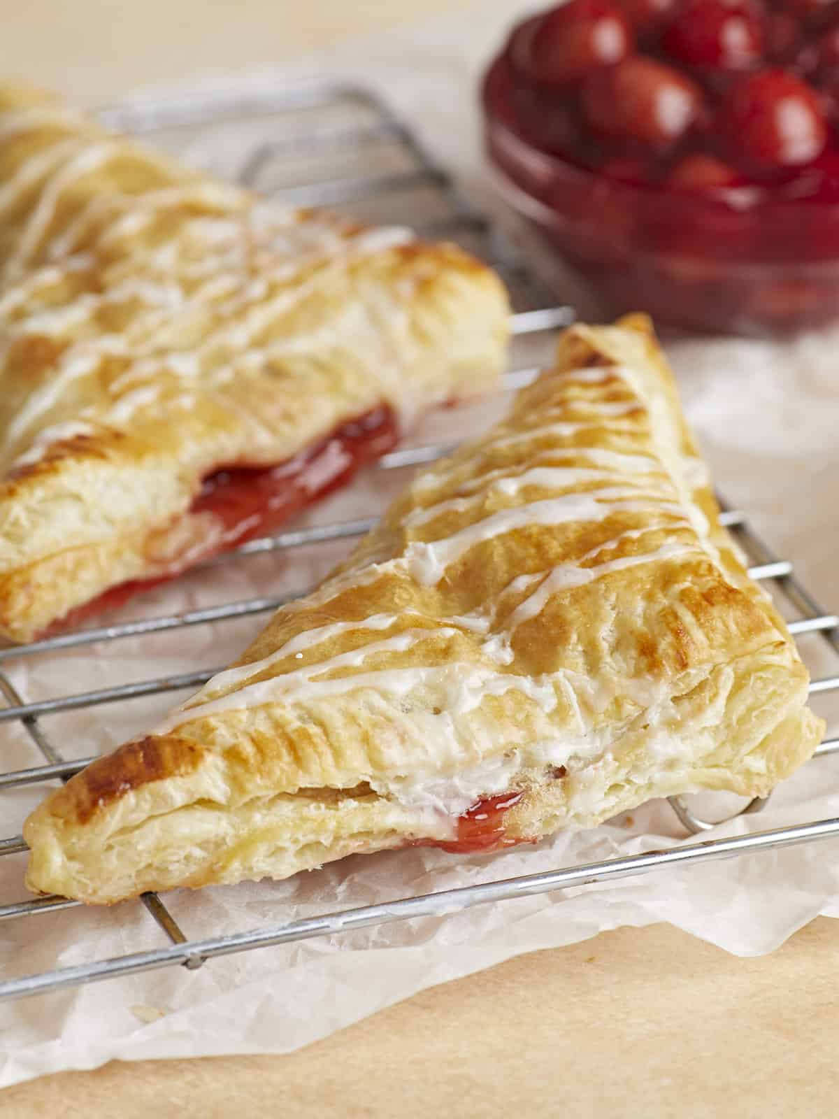 Side view of cherry turnovers on the wire cooling wrack.