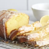 Side view of a sliced loaf of lemon pound cake.