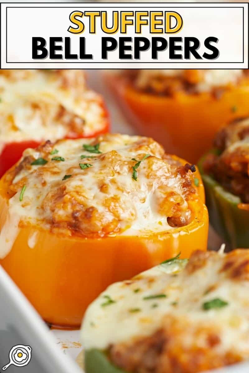 Close up view of a stuffed bell pepper in a white casserole dish topped with mozzarella cheese.