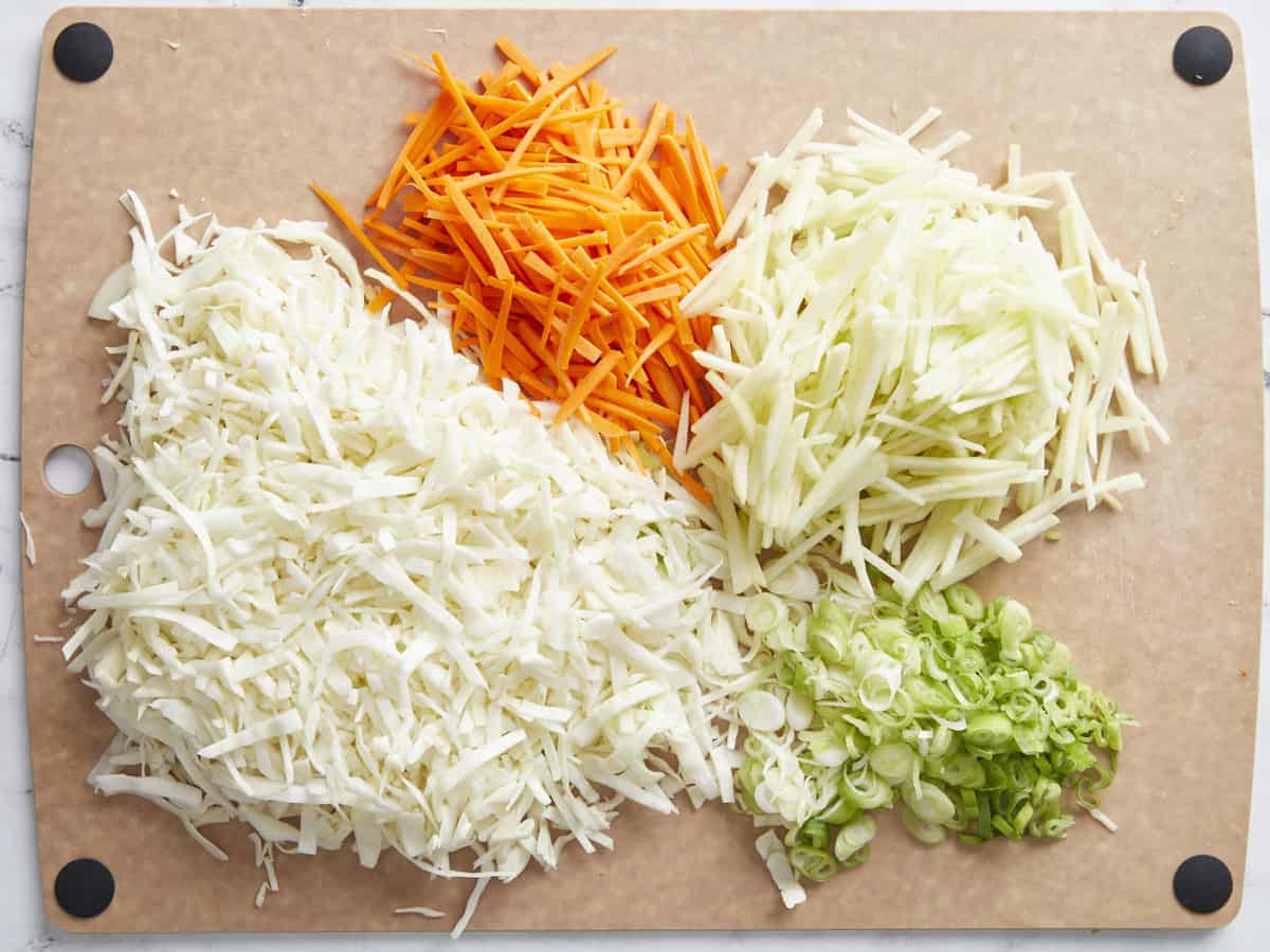 Prepared vegetables on a cutting board.