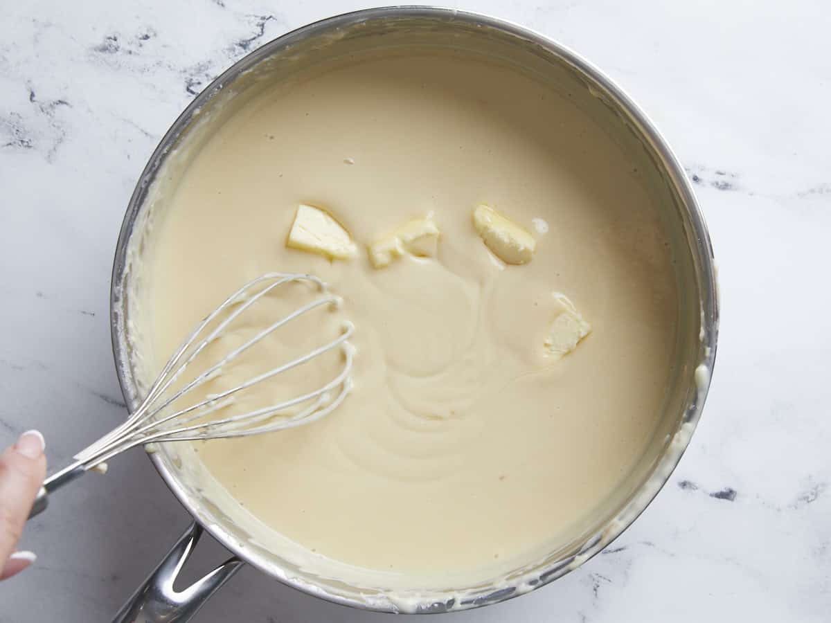 Butter being melted into the coconut custard. 