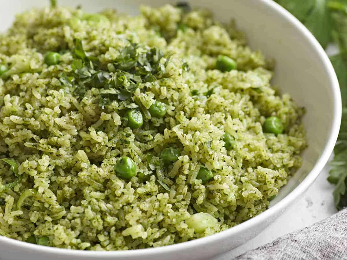 Side front view of a bowl full of Arroz Verde.