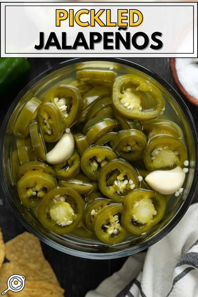 Overhead view of a bowl of pickled jalapeños.